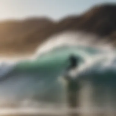 Surfer catching a wave at Jalama Beach