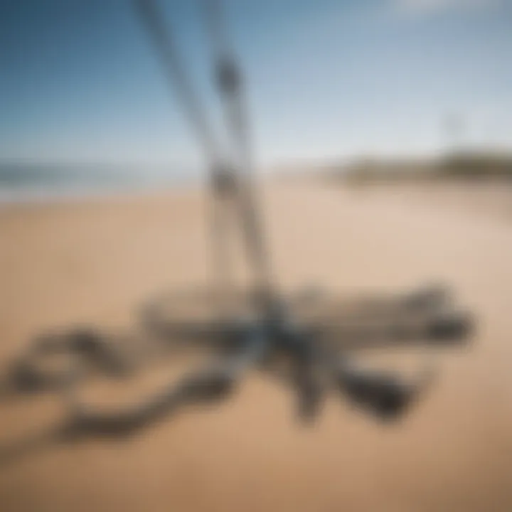 Variety of kite anchors displayed on a sandy beach