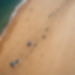 Aerial view of a kite ground stake in action on a sandy beach