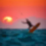 Kite surfing at sunset over the Atlantic Ocean