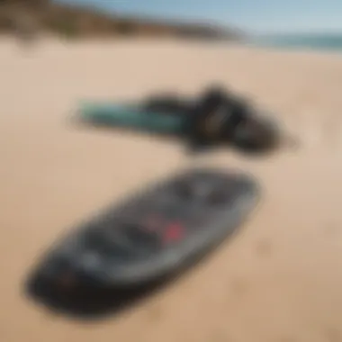 A close-up of essential kite surfing equipment laid out on the sandy beach of Paros