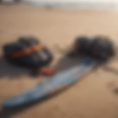 Close-up of kite surfing gear laid out on the beach