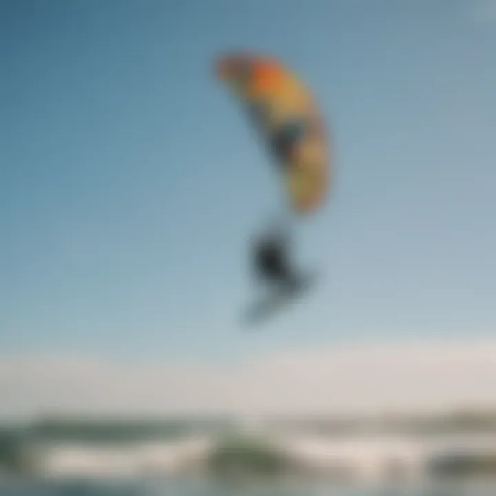 Kite surfer performing impressive tricks under clear blue skies in Michigan