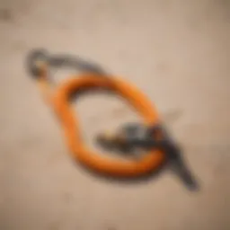 Kiteboard safety leash coiled on a beach