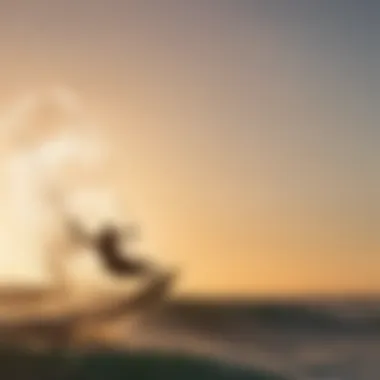 Silhouette of a kiteboarder riding the waves at sunset