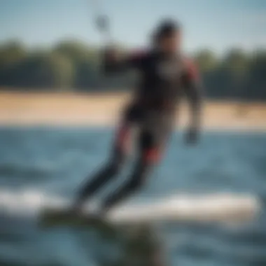 Kiteboarder gliding gracefully over the water in a drysuit