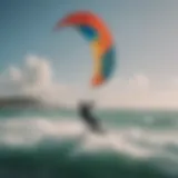 A vibrant kite soaring high above the ocean