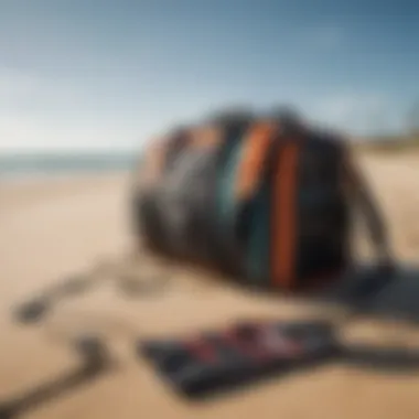 A vibrant kiteboarding gear bag on a sandy beach