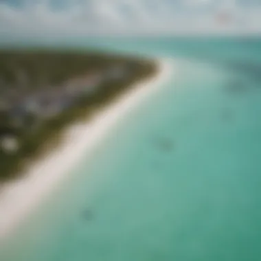 Kiteboarder gliding over clear turquoise waters