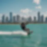 A kiteboarder gliding over turquoise waters with the Miami skyline in the background