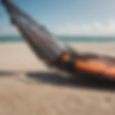 Close-up of high-quality kiteboarding gear laid out on sandy beach