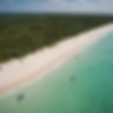 Aerial view of El Cuyo's pristine beaches and kiteboarders