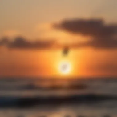 Silhouette of a kiteboarder performing impressive aerial tricks against a vibrant sunset sky