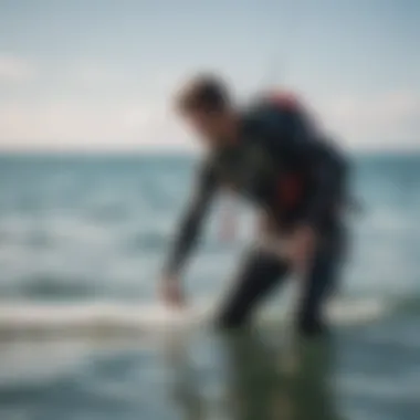 Kitesurfer performing safety leash check on the water