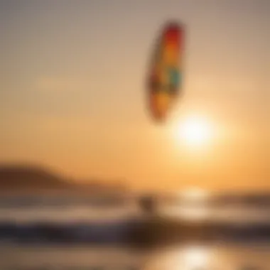 Kite surfer catching air with the sun setting in the background