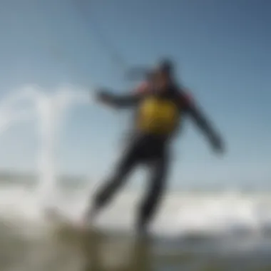 Kitesurfer in a drysuit gliding through the waves