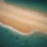 Aerial view of kitesurfing equipment on a sandy beach