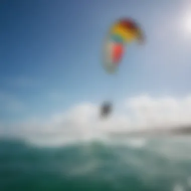 A vibrant kitesurfing community enjoying a sunny day, with kites flying high against a blue sky