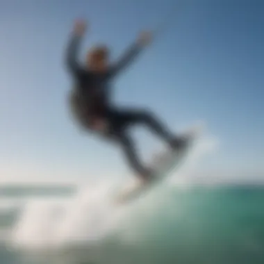 A kitesurfer executing a perfect jump over a crystal-clear wave