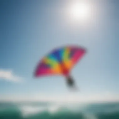 A colorful kitesurfing kite soaring in the clear blue sky