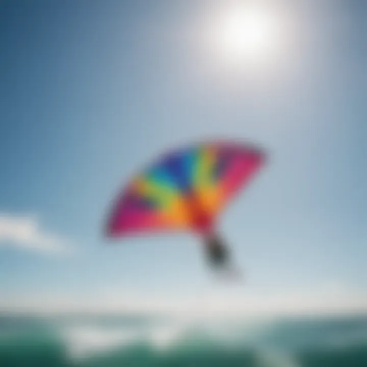 A colorful kitesurfing kite soaring in the clear blue sky