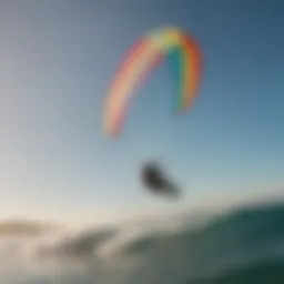 Kiteboarder soaring through the waves with a colorful kite