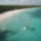 A picturesque view of kitesurfers gliding over the turquoise waters of Tulum.