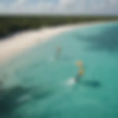 A picturesque view of kitesurfers gliding over the turquoise waters of Tulum.