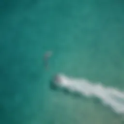 Aerial view of kitesurfers on turquoise waters