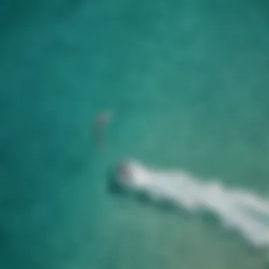 Aerial view of kitesurfers on turquoise waters