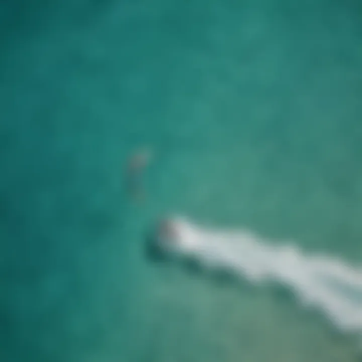 Aerial view of kitesurfers on turquoise waters