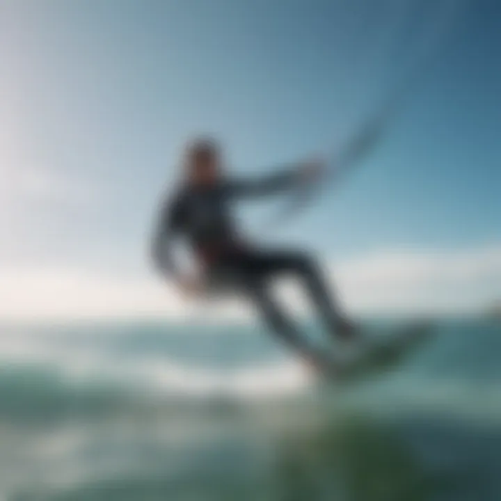 Kiteboarder carving through crystal clear waters with vibrant kite in the sky