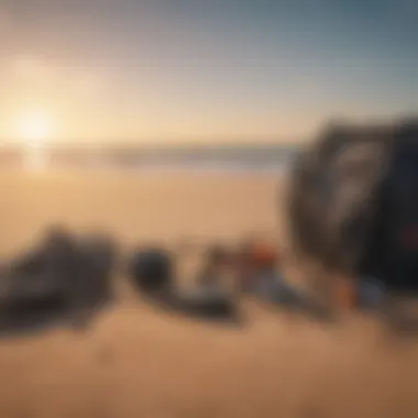 Kitesurfing equipment laid out on a sandy beach