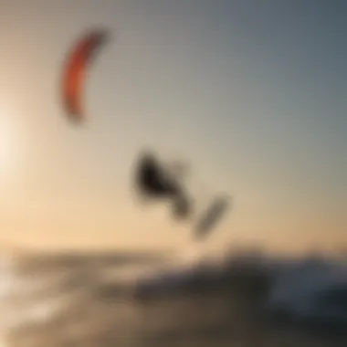 Sunset silhouette of a kitesurfer gliding gracefully across the horizon