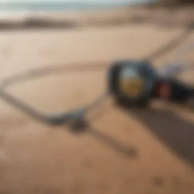 Close-up of kitesurfing equipment on sandy beach