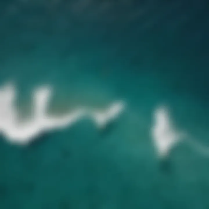 Aerial view of kitesurfers riding the waves in Maui's crystal-clear waters