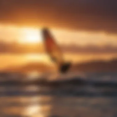 Silhouette of kitesurfer against the vibrant Maui sunset