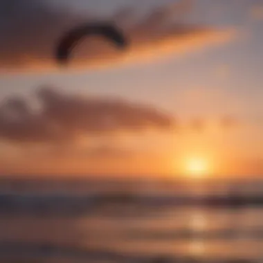 Silhouette of kitesurfer against colorful sky at dusk