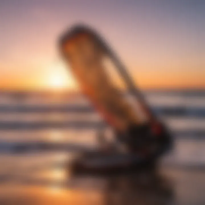 Kitesurfing equipment against a vibrant sunset sky