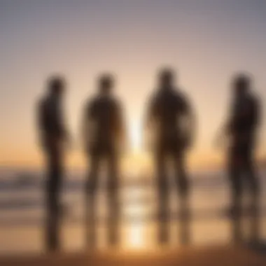 Kitesurfing enthusiasts discussing harness options on a beach during sunset.