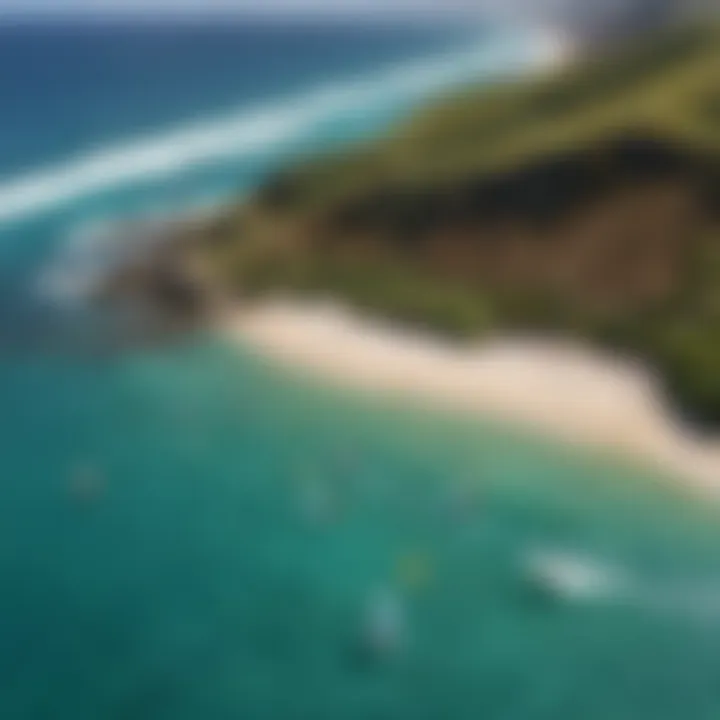 Aerial view of Oahu coastline with colorful kitesurfing sails