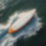 Aerial view of a sleek surfboard on ocean waves