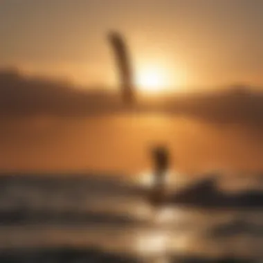 Silhouette of a kiteboarder against a setting sun on the horizon