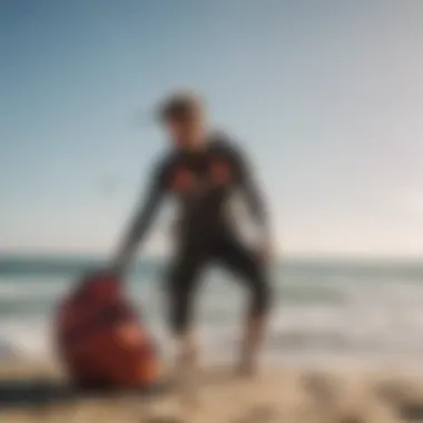 An adventurous kitesurfer packing a kite surf bag on the shoreline, preparing for a session.