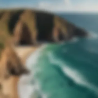 A panoramic view of the rugged coastline at Rugged Point with kitesurfers in action