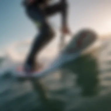 Close-up of a kitesurfer's board slicing through the water