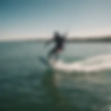 Aerial view of kiteboarder performing advanced maneuver over crystal clear waters