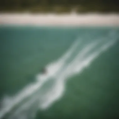 Aerial view of kitesurfers riding the waves in Palm Bay