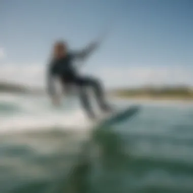 Scenic view of a kitesurfer gracefully gliding across the water with the Naish Hover