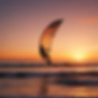 A silhouette of a kite surfer against a vibrant sunset sky